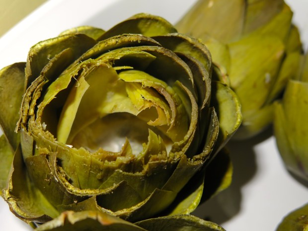 A grapefruit spoon would work best for removing the furry middle, I don't have one, and use a teaspoon. 